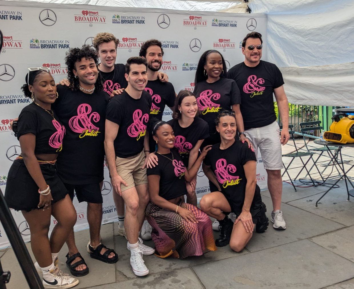 Cast members of & Juliet posing for a group photo at Broadway in Bryant Park.