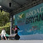 Performers on stage during Broadway in Bryant Park event.