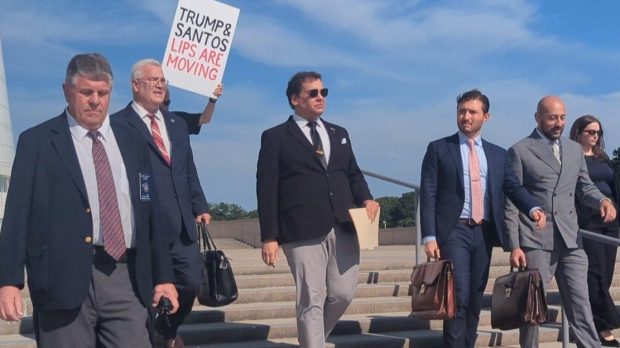 George Santos and his legal team leave the U.S. District Court following his guilty plea hearing.